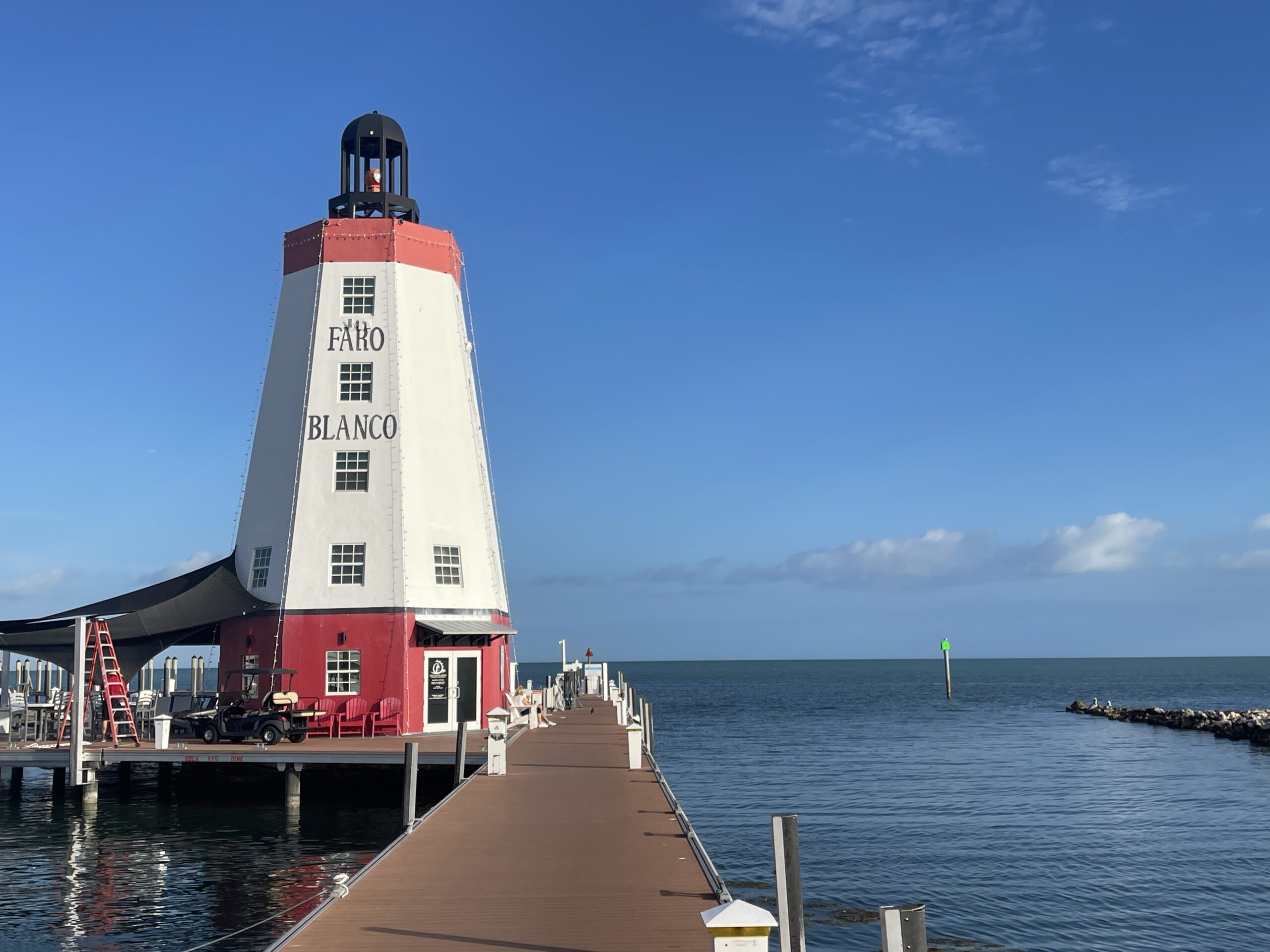 BRADventures docked at Faro Blanco Lighthouse in Marathon, Florida, under clear blue skies.