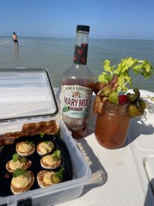 Sandbar Brunch with a Kick Custom Bloody Mary cocktail and deviled eggs served on a boat at a sandbar in Naples, Florida