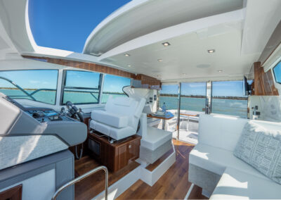 Retractable sunroof open aboard BRADventures yacht with views of the sky and water